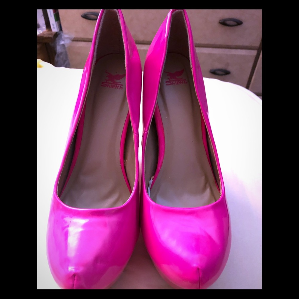Neon pink wedge shoes